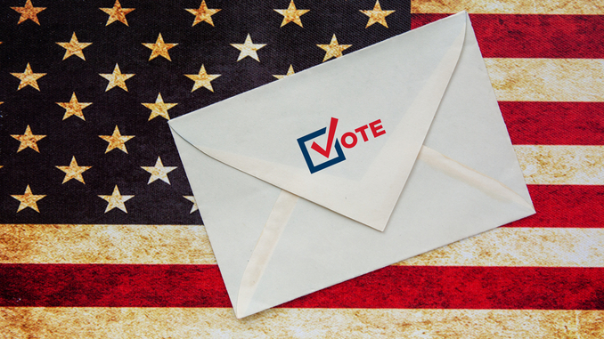 American flag with voting envelope