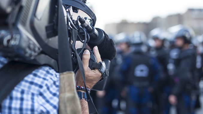 cameraman recording police