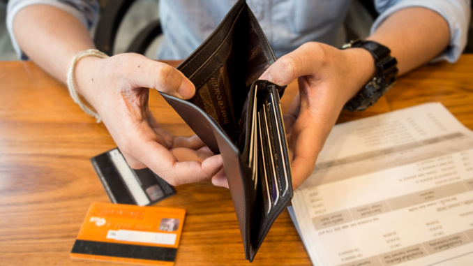 empty wallet with credit cards on table